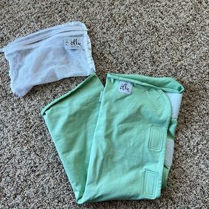 Ollie swaddle meadow.  Like new, barely used